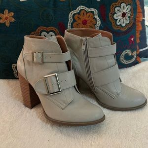 Gray booties with silver buckle details